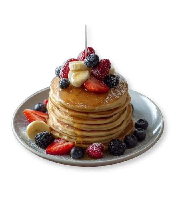 Fluffy Buttermilk Pancakes served with butter and syrup at NY Diner Boston in Brighton MA