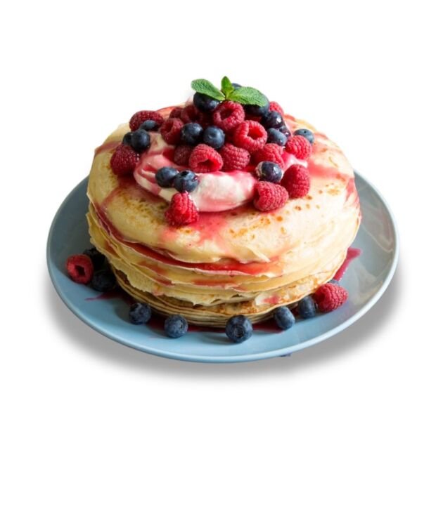 Berry Pancakes topped with fresh strawberries and blueberries at NY Diner Boston in Brighton MA