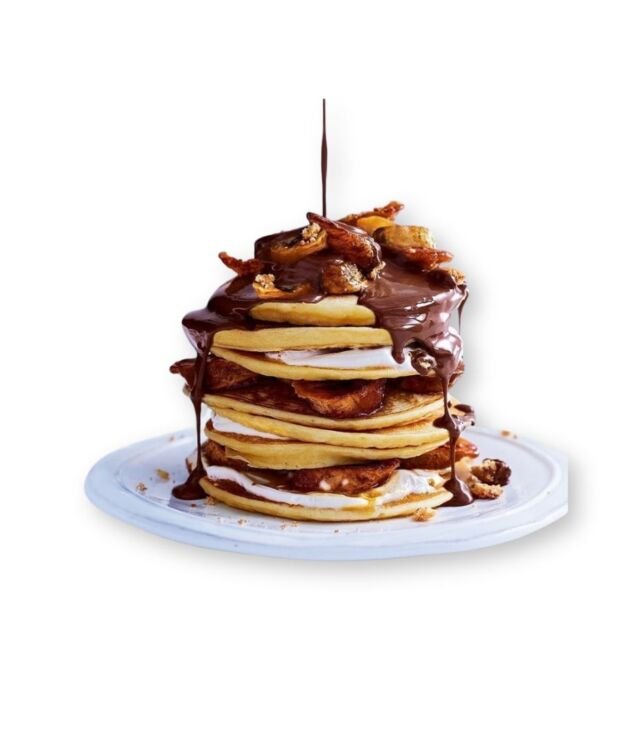 Nutella Pancakes drizzled with chocolate and topped with whipped cream at NY Diner Boston in Brighton MA