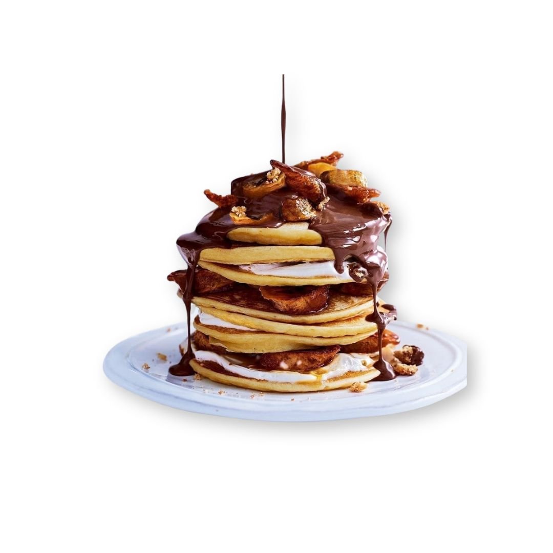 Nutella Pancakes drizzled with chocolate and topped with whipped cream at NY Diner Boston in Brighton MA