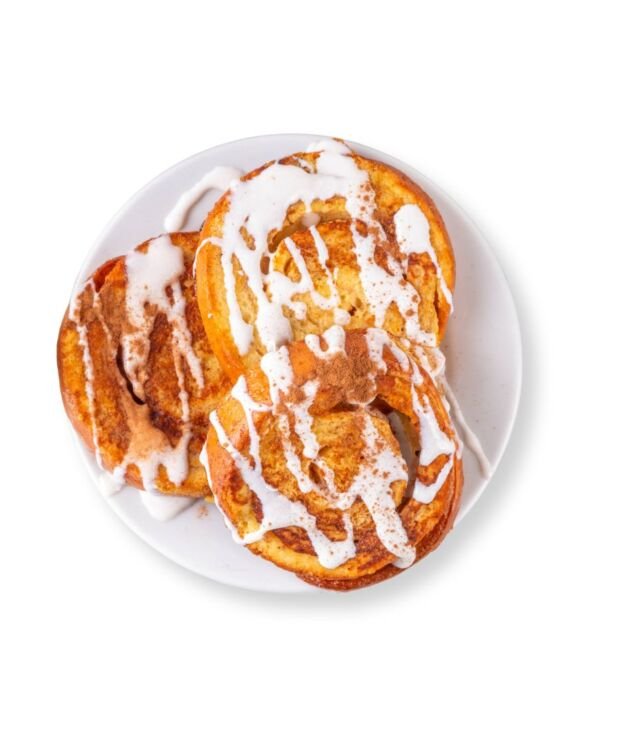 Cinnamon Roll French Toast drizzled with icing and syrup at NY Diner Boston in Brighton MA